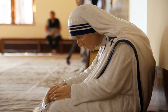 Statue of Mother Teresa in the chapel of the Mother House, Kolkata, India. The statue was made in the pose in which the Mother prayed.