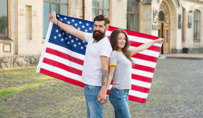American tradition. American patriotic people. American citizens couple USA flag outdoors. Patriotic spirit. Independence day. National holiday. Bearded hipster and girl celebrating. 4th of July