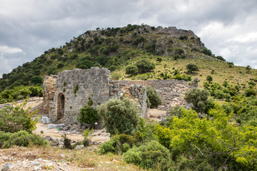 Ancient city of Kaunos, Dalyan valley, Turkey. Kaunos (Latin: Caunus) was a city of ancient Caria and in Anatolia, a few km west of the modern town of Dalyan, Muğla Province, Turkey.