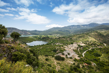 Ancient city of Kaunos, Dalyan valley, Turkey. Kaunos (Latin: Caunus) was a city of ancient Caria and in Anatolia, a few km west of the modern town of Dalyan, Muğla Province, Turkey.