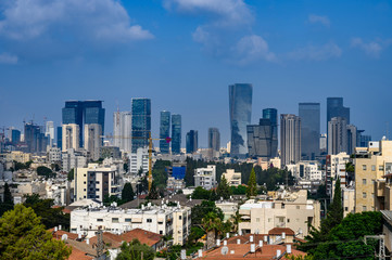 Fototapeta na wymiar Tel Aviv skyline in early morning. Rooftop view to the city. Old houses and new modern skyscrapers.