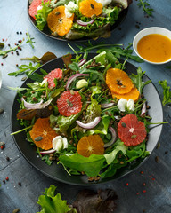 Orange and grapefruit Citrus salad with lentills vertes, wild rocket, arugula, red onion and sprinkle of pumpkin seeds
