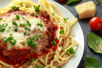 Chicken Parmesan with Cheese and Marinara Sauce served over spaghetti, pasta
