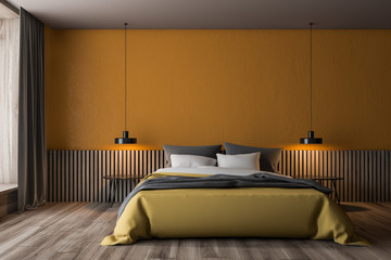 Orange and wooden bedroom interior