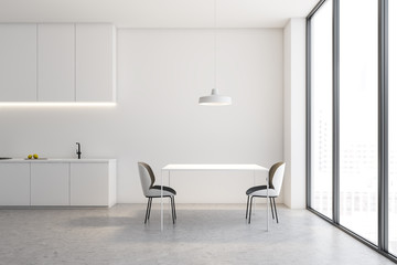 White loft kitchen interior with table