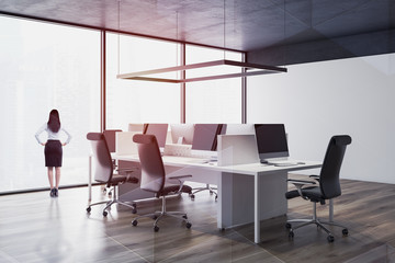 Woman in black ceiling open space office