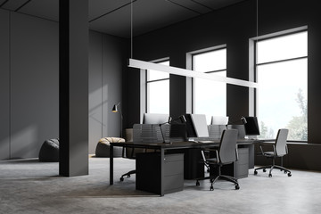 Grey open space office corner with windows