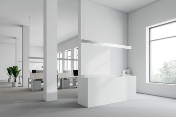 White reception desk in office corner