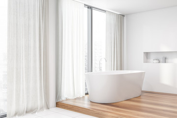 Obraz na płótnie Canvas White bathroom corner, tub and window