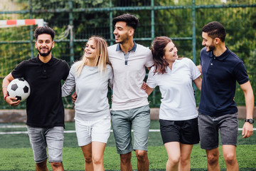 Young football team. Friends play sports. Team  ready to play game.