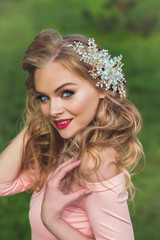 Beautiful woman with modern hairstyle and hair jewelry