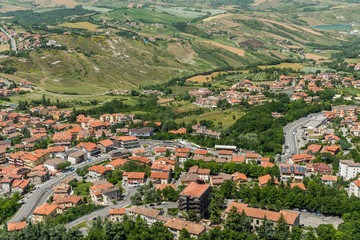 Fototapeta na wymiar Panoramic View of San Marino with a Road Crossing the Beautiful Landscape
