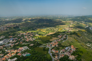 Fototapeta na wymiar A Spot of Sun on the Beautiful Panorama of San Marino as Seen from Monte Titano