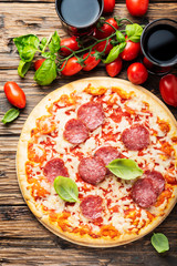 Italian pizza with tomato and salami