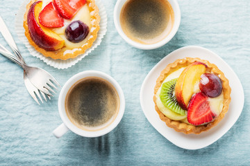 Mini tarts with cream and mix of summer fruit