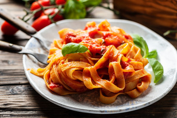pasta fettuccine with tomato and basil - obrazy, fototapety, plakaty