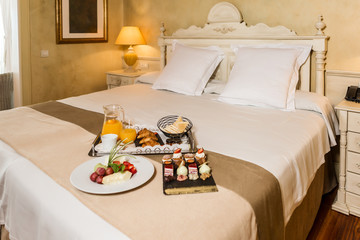Breakfast food on hotel bed