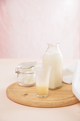 fresh milk in glasses with sugar cubes