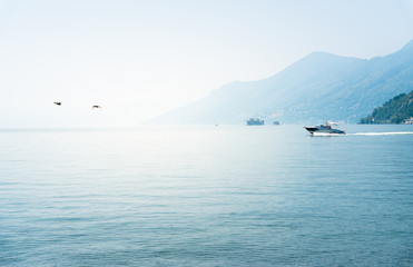 Landscape of lake Maggiore on a hot foggy day
