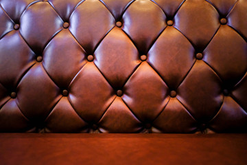 Brown leather sofa texture background.