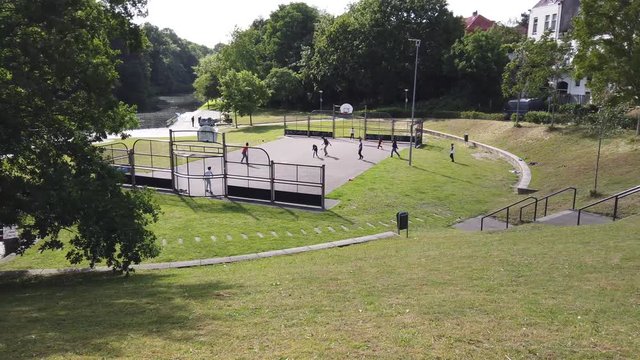 Footage of street soccer encompass a number of informal varieties of association football showing throw in and players moving to goal and scoring a point winning the match 4k high resolution quality