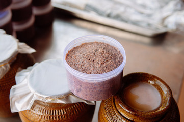Thai fermented salty shrimp paste in plastic container