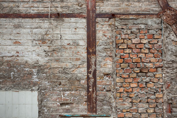 Rusty Metal beams support system for old brick walls
