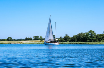 Small sailboat on the river Schlei in Schleswig Holstein, Germany
