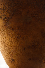 A fragment of an old clay pot. Close-up The small depth of field