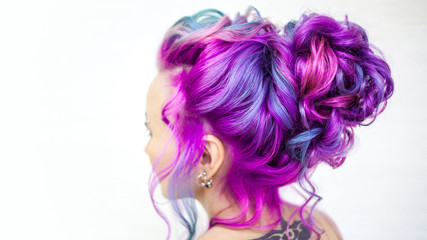 Wedding hairstyle of curls for a modern and unusual bride. Portrait of a young stylish woman with bright colored hair.