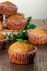 Vanilla cupcake, homemade pastry on wooden background