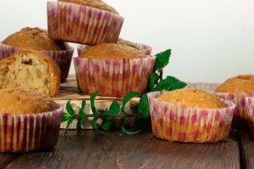 Vanilla cupcake, homemade pastry on wooden background