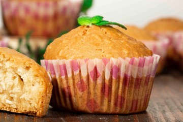 Vanilla cupcake, homemade pastry on wooden background