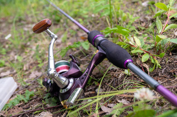 spinning lying on the ground. fishing tackle