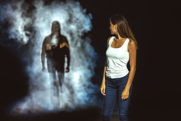 The man in the dark street following the woman