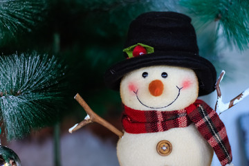 Decoration Snowman on christmas tree background