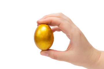 Golden egg in hand on a white background, isolate. Concept of wealth, winnings, good luck