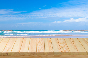 Empty wooden table over sea background. Summer holiday vacation concept