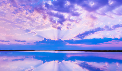 Naklejka na ściany i meble Beautiful scenery with colorful sky, beautiful water reflectioncloud, clouds and sunbeams.Artistic picture. Beauty world. Panorama