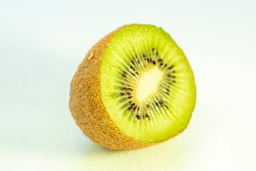 close-up of a kiwifruit in front of a white background