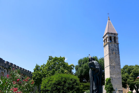 Historical bell tower and statue of bishop Grgur Ninski, landmarks in Split, Croatia.