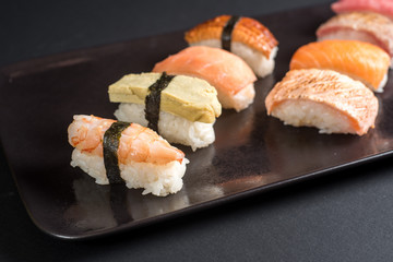 sashimi sushi set on black background
