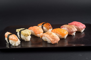 sashimi sushi set on black background