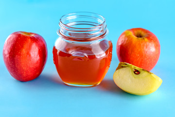 Rosh hashanah jewish holiday concept. Honey and apple over blue background. Healthy food.