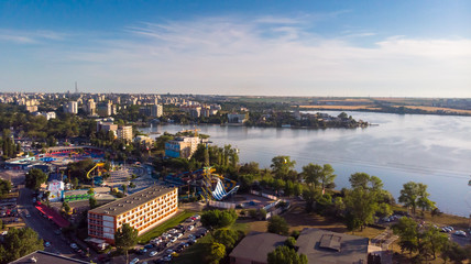 Fototapeta premium Aerial view of beach in Mamaia, Constanta, popular tourist place and resort on black sea in a Romania. At one side of this place is located lake, and at other side is a Black Sea.