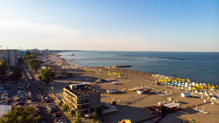 Aerial view of beach in Mamaia, Constanta, popular tourist place and resort on black sea in a Romania. At one side of this place is located lake, and at other side is a Black Sea.