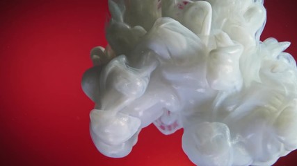 White nacreous paint in water against red background. - Powered by Adobe