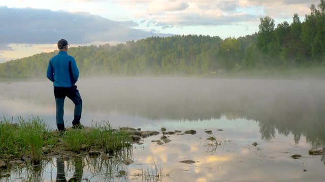 Gentleman Observes And Enjoys Dawn On Clear Lake Bank