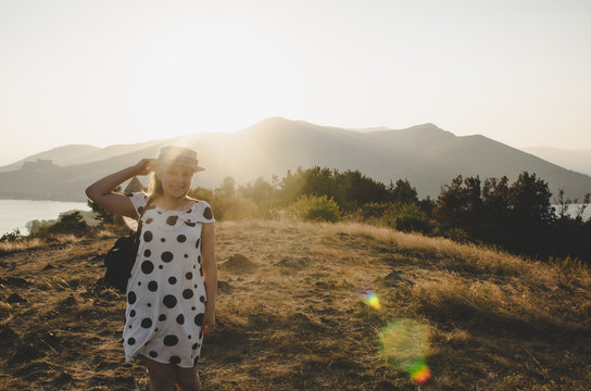 young woman walking in field in Armenia