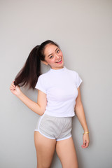 Naklejka premium Asian girl in sportswear with happy expression.